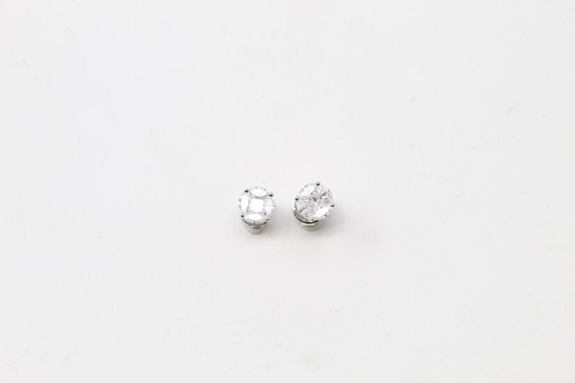 Pair of 18k (750) white gold ear studs with round and shuttle diamonds