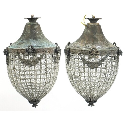 Pair of ornate bronzed metal chandeliers, 50cm high