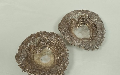 Pair of pierced and embossed bon bon dishes of heart shape, ...