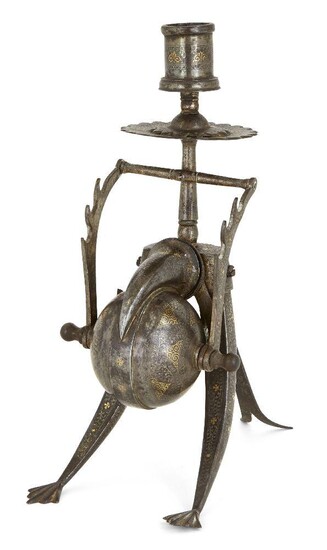 Property from an Important Private Collection A koftgari steel inkwell and candlestick, India, late 19th century, India, late 19th/early 20th century, of whimsical and unusual shape, resting on three curved legs, one foldable, the candlestick...
