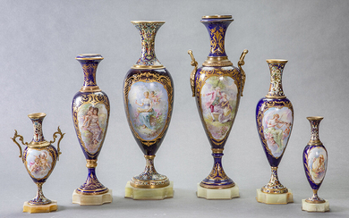 Set of six porcelain vases in Sévres cobalt blue with onyx bases and glazed and signed scenes in the reserves. Gilt bronze mounts. Four of them with feet and mouths in enamel. Largest height: 46 cm. Exit: 300uros (49.916