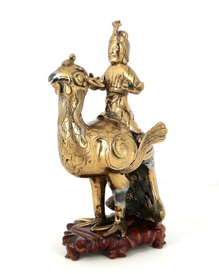 South East Asian mixed alloy figure on a phoenix
