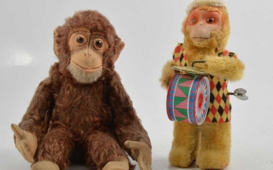 Steiff monkey toy, and a wind-up monkey toy