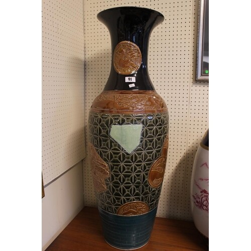 Tall 20thC Chinese Pottery vase with carved panels depicting...