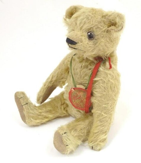 Toys: A 20thC teddy bear with stitched nose and paws