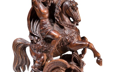 Une figure allemande en bois de boeuf sculpté représentant Saint Georges et le dragon, 19ème...