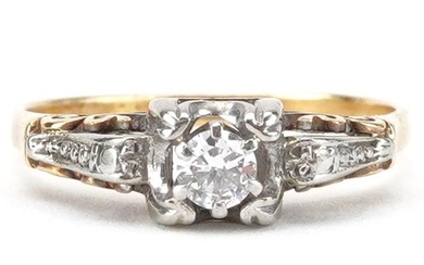 Unmarked gold diamond solitaire ring with ornate setting, to...