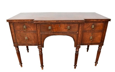William IV mahogany breakfront sideboard with an arrangement of drawers, on turned and fluted legs