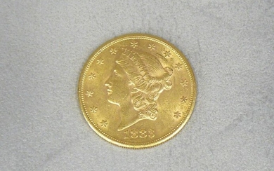 A gold 20-dollar coin dated 1883 Liberty's head.