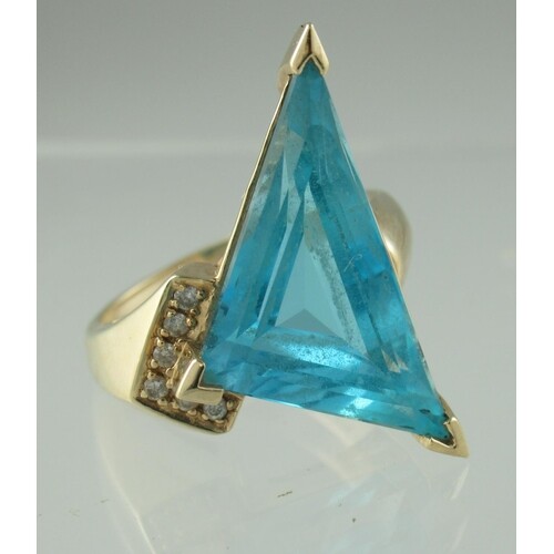 14ct gold blue topaz and diamond ring. The triangle cut blu...