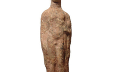A tall Greek terracotta figure of a youth