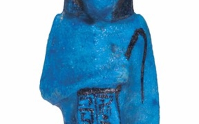 AN EGYPTIAN BRIGHT BLUE FAIENCE OVERSEER SHABTI FOR THE CHIEF CONTROLLER OF THE HAREM OF AMUN, SUPERIOR OF THE NOBLE WOMEN, NESTANEBISHERU, THIRD INTERMEDIATE PERIOD, 21ST DYNASTY, CIRCA 980 B.C.