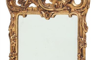 A 19th century gilt wood and gesso mirror, richly carved with flowers,...