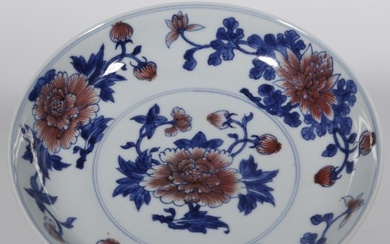 A BLUE-AND-WHITE PORCELAIN PLATE.