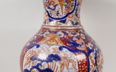 A C19th Imari porcelain vase painted with traditional patterns...