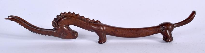 A CHINESE BRONZE BRUSH REST IN THE FORM OF AN ANTELOPE