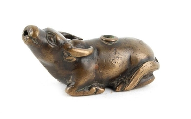 A Chinese bronze water dropper modelled as a recumbent...