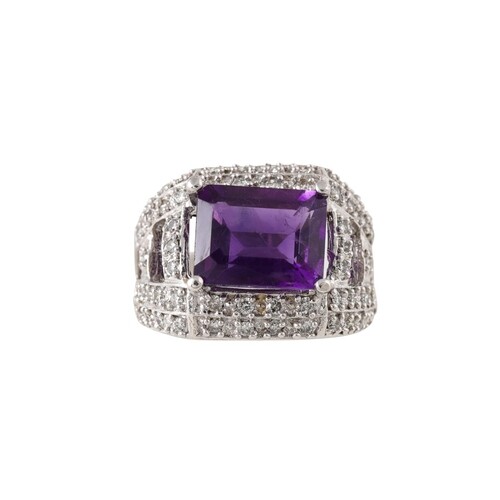 A DIAMOND AND AMETHYST DRESS RING, mounted in 14ct gold