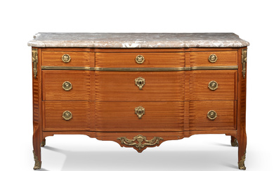 A LATE LOUIS XV ORMOLU-MOUNTED BOIS SATINE COMMODE BY DANIEL...