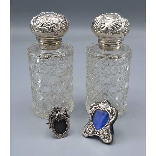A Pair of Silver Topped Cut Glass Scent Bottles, 13.5 cms ta...