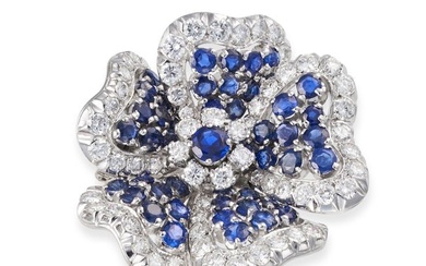 A SAPPHIRE AND DIAMOND FLOWER BROOCH set to the centre with a round cut sapphire in a cluster of