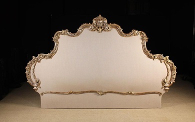 A Splendid King Sized Louis XV Style Bed Head. The arch-topped padded board upholstered with a ecru