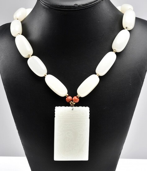 A TREATED JADE RECTANGULAR PENDANT AND NECKLACE WITH CORAL DETAIL, TOTAL LENGTH 530MM