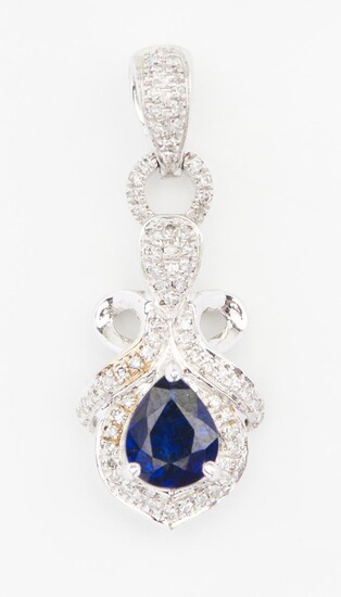 A TREATED PEAR CUT BLUE SAPPHIRE AND DIAMOND PENDANT IN 18CT WHITE GOLD, WITHIN A SCROLL DIAMOND SET SURROUND AND BALE, LENGTH 23MM,...
