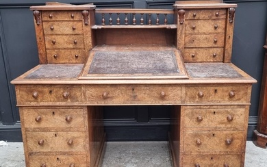 A Victorian burr walnut Dickens desk, 142.5cm wide....