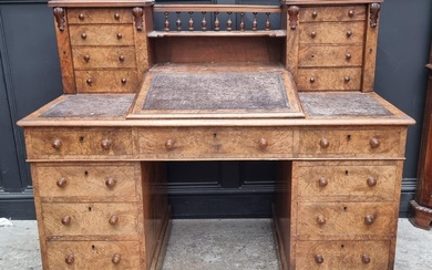 A Victorian burr walnut Dickens desk, 142.5cm wide....