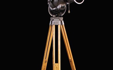 A Vintage 'STRAND ELECTRIC' Stage Light mounted on a tall height adjustable wooden tripod with spike