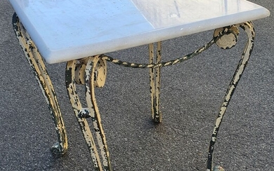 A WROUGHT IRON BASED MARBLE TOP TABLE