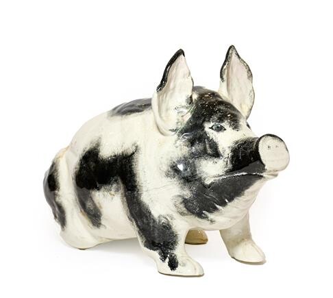 A Wemyss Pottery Pig, early 20th century, naturalistically modelled seated, with black sponged...