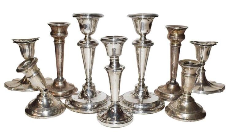 A collection of assorted silver candlesticks, a/f, filled (one tray)...