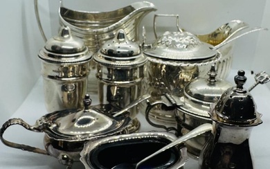 A collection of sterling silver tableware to include an Elizabeth...