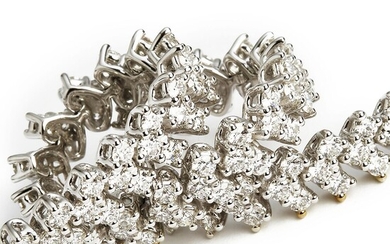 NOT SOLD. A diamond bracelet set with numerous brilliant-cut diamonds weighing a total of app. 5.64 ct., mounted in 18k white gold. F-G/VS. Triple ex.-cut. H & A. – Bruun Rasmussen Auctioneers of Fine Art