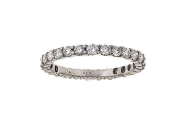 A diamond eternity ring, by Boucheron, claw set with brilliant-cut diamonds, indistinctly signed Boucheron and numbered, French assay and maker's mark, for Boucheron, ring size S 1/5