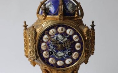 A gilt bronze and enamel clock decorated with...