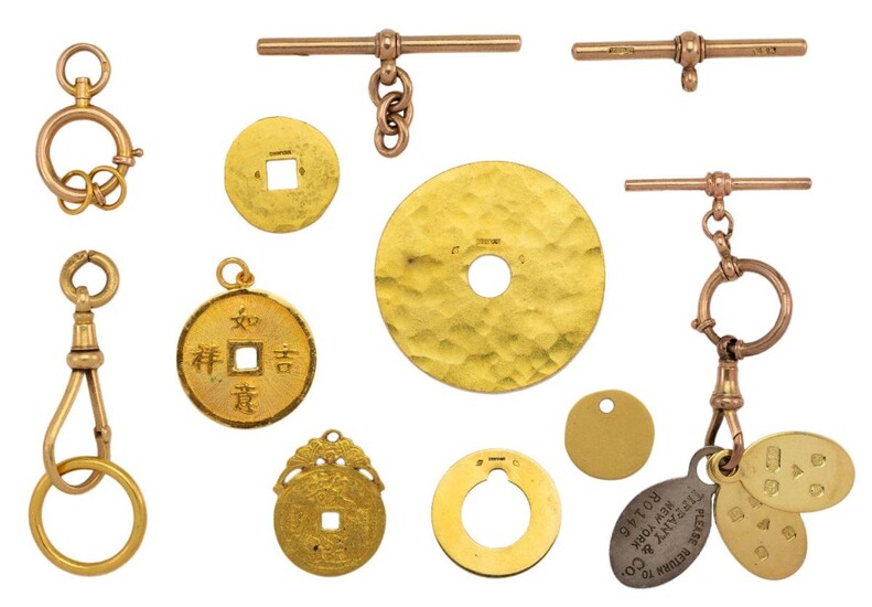 A group of jewellery findings, comprising: three gold open discs of varying design and size by Dinhvan, French marks; two 18ct gold oval charms stamped G&Co LD, London hallmarks and a silver ‘Return to Tiffany’ oval charm, stamped STERLING SILVER...