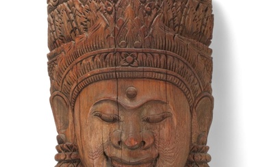 A large Burmese relief carved wood mask wall carving, height...