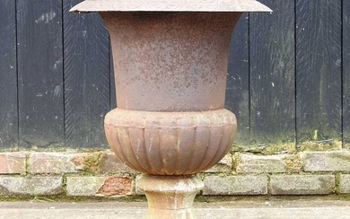 A large cast iron garden urn, of campana shape, 67cm...