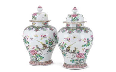 A large pair of Chinese Famille Rose vases and covers