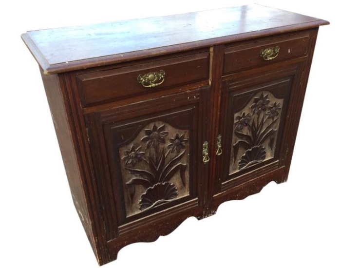 A late Victorian stained sideboard, the rectangular moulded top...