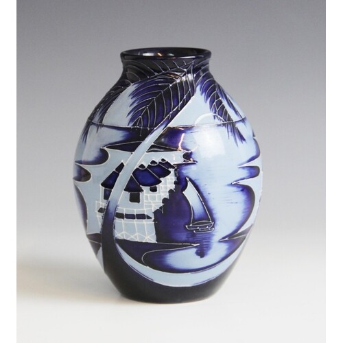 A limited edition Moorcroft vase in the 'Blue Lagoon' patter...