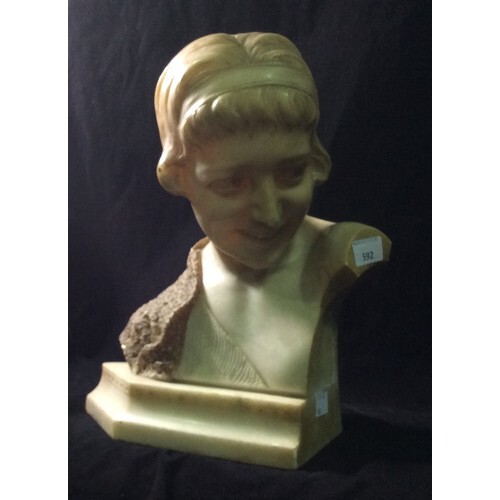 A marble sculptural bust, modelled as a young 1920’s/30’s gi...