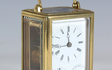 A mid to late 19th century French lacquered brass carriage calendar timepiece with eight day movemen
