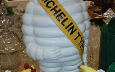 A painted metal Michelin Tyres Michelin Man figure and...