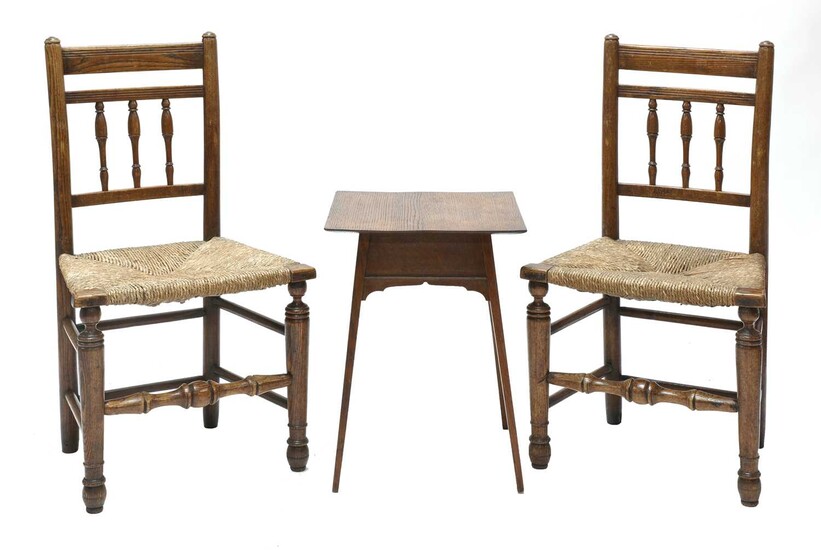 A pair of Arts and Crafts oak side chairs
