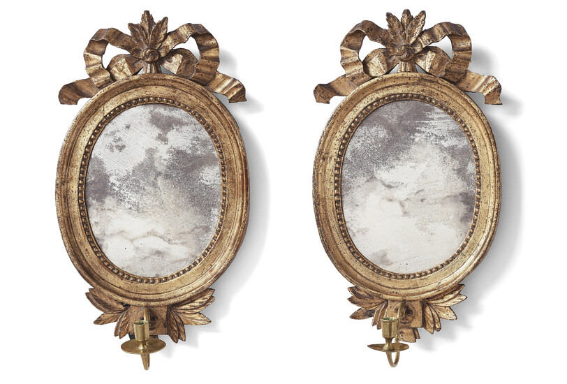 A pair of Gustavian late 18th century one-light girandole mirrors.