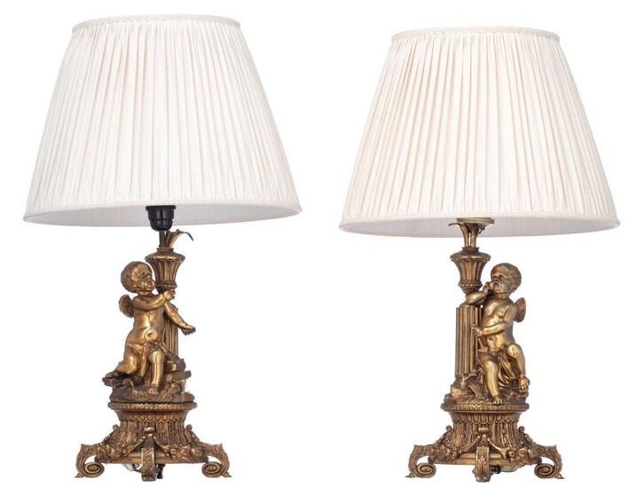 A pair of Napoleon III gilt bronze table lamps, decorated with Amor figures, H 38 - 67 cm